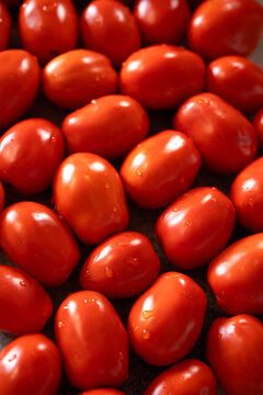 Fresh red tomatoes as background