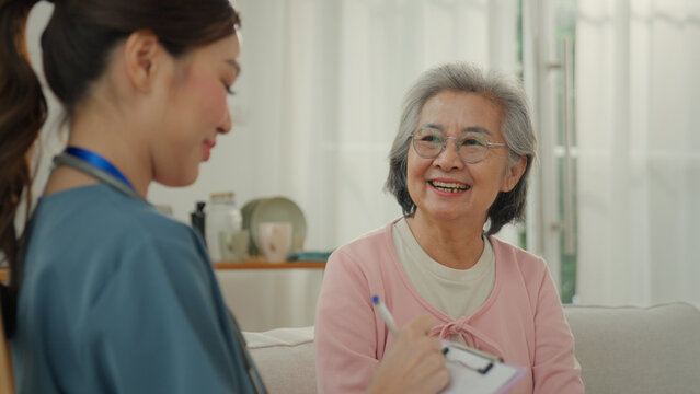 Elderly care nursing home caregiver smiling woman with nurse in home setting