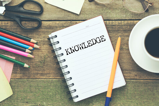 KNOWLEDGE word on white paper