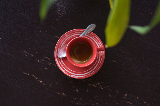 Cup of coffee on dark wood