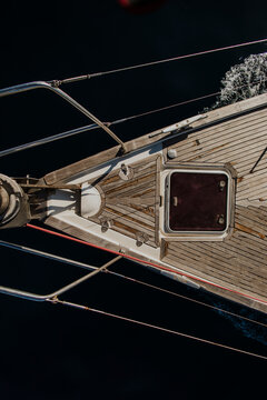 Directly above view of a wooden yacht bow sailing on the sea