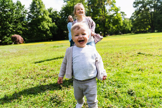 Happy boy with family in a park