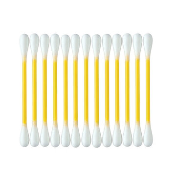 Clean cotton swabs with yellow liquid