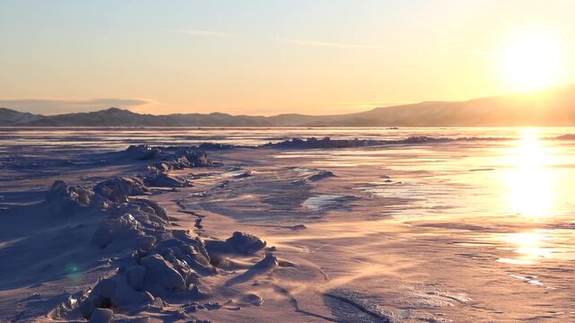 View of jagged ice formations and wind-blown snow on the frozen surface of Lake Baikal in Khuzhir, Irkutsk Oblast, Russia.