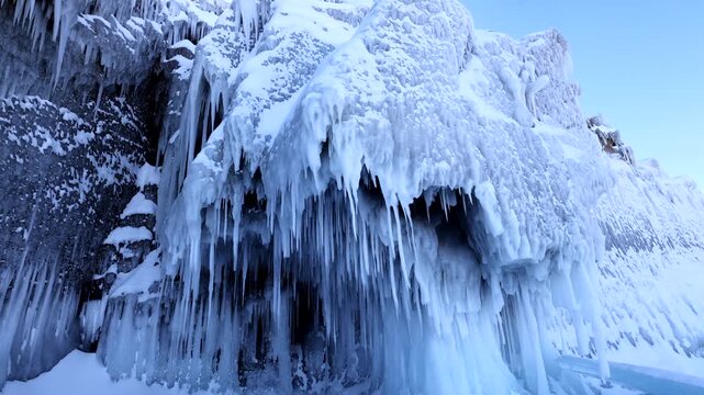 View of frozen icicles hanging from rocky cliffs along the shore of Lake Baikal in Khuzhir, Irkutsk Oblast, Russia.