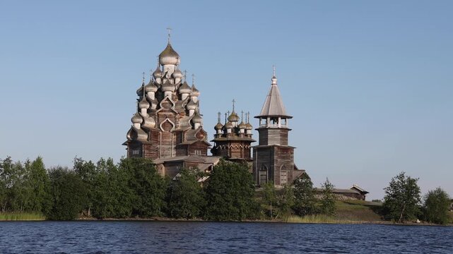 View of the historic wooden Kizhi Pogost church complex with its iconic multi-domed architecture situated on the shore of Lake Onega in Petrozavodsk, Republic of Karelia, Russia.