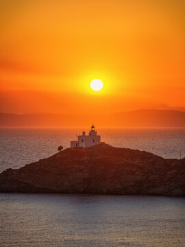 Close-up view of the lighthouse at the island of Kea - Tzia, Cyclades, Greece, during a beautiful summer sunset