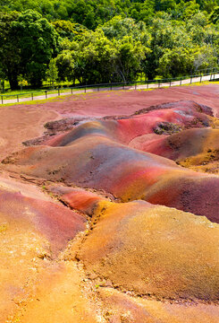 Chamarel Seven Colored Earth Geopark in Mauritius Island. Colorful panoramic landscape about this volcanic geological formation Chamarel Seven Colored Earth Geopark in Riviere noire district.