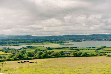 Fototapeta premium Dungarvan historic architecture, scenic landscape and picturesque bay on the coast of County Waterford, Ireland - Dungarvan, County Waterford, Ireland - 31 August 2023.