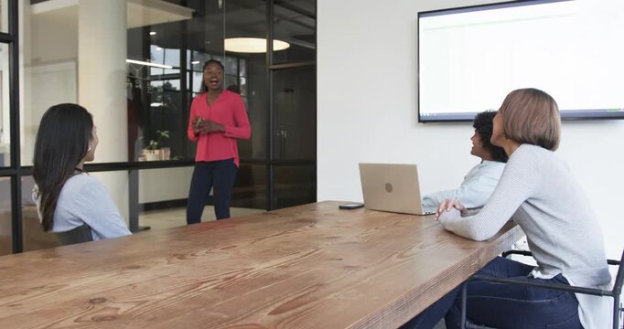 Lifestyle videos indoor of people doing activities at office, giving presentation, woman presenting