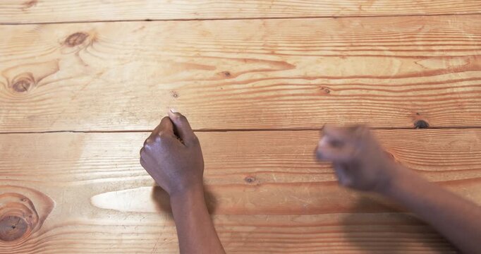 Close up of people talking to the camera, on wooden desk, person working on business project with fo