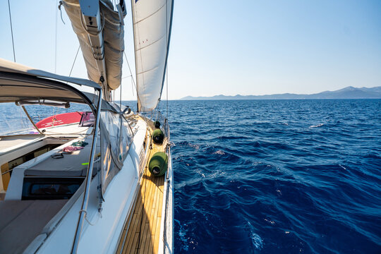 Sailing yacht cruising across the Adriatic Sea under full sail. Freedom and adventure during a long distance sailing voyage.