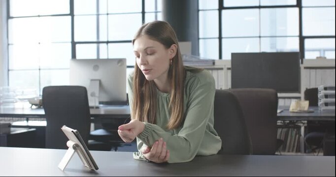 Close up of people talking to the camera, in office, woman video conferencing on tablet, expressing