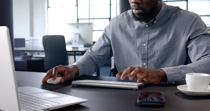 Lifestyle videos indoor of people doing activities at office, typing on keyboard, man working at des