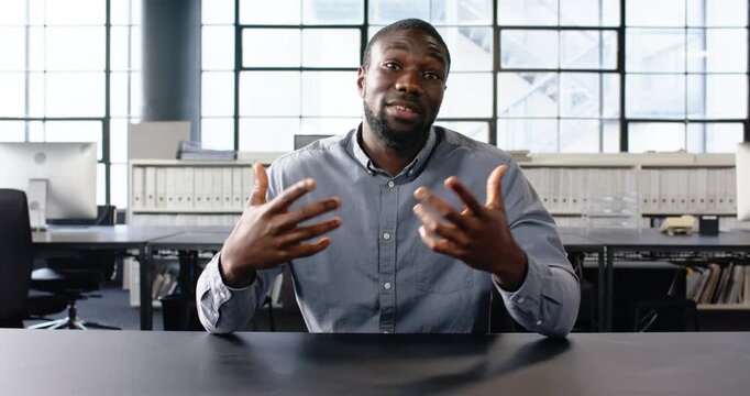 Close up of people talking to the camera, businessman in office explaining, using gestures