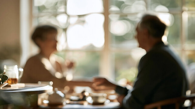 Senior couple sharing intimate conversation and relaxing at home during a peaceful morning tea