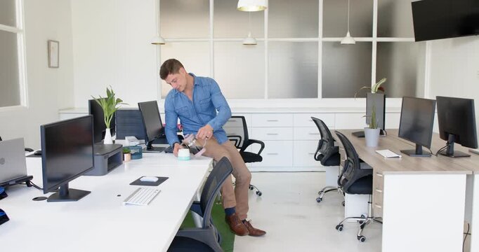 Lifestyle videos indoor of people doing activities at office, man standing in modern office with mul