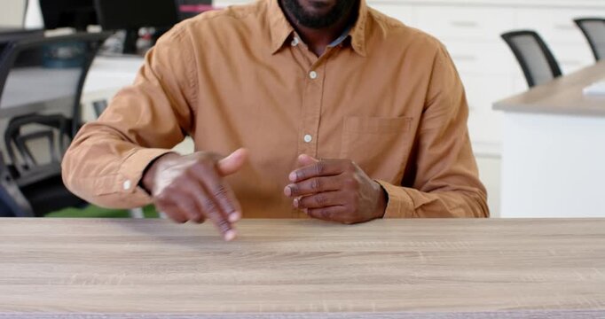 Close up of people talking to the camera, gesturing with hands, man in brown shirt explaining someth