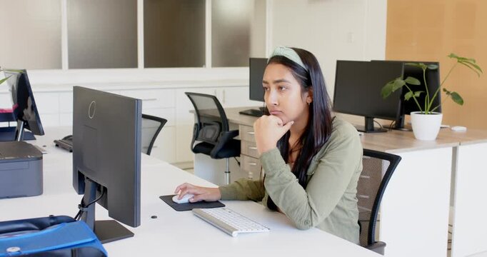 Lifestyle videos indoor of people doing activities at office, typing on keyboard, woman working at d