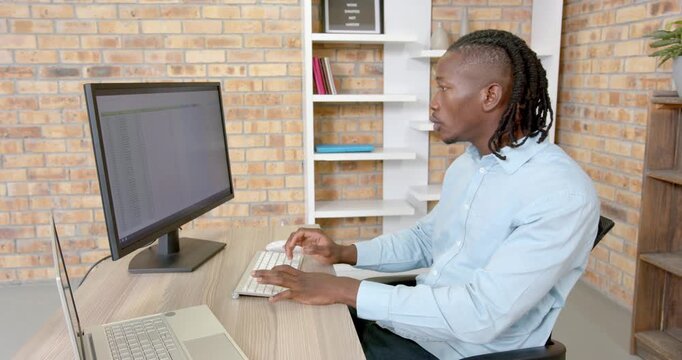 Lifestyle videos indoor of people doing activities at office, typing on keyboard, man working on com