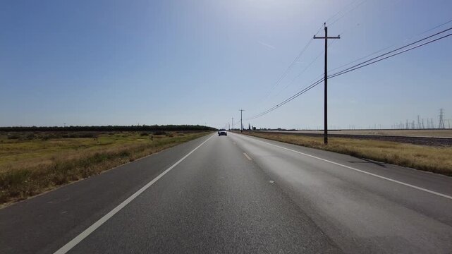 San Joaquin Valley Farmland Buttonwillow 04 Rear View Driving Plates of Highway 58 West California USA