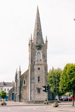 Tower and spire of St Mary Priory Church, a historic Grade II in Monmouth, Wales, featuring a clock face and distinctive Gothic architecture - Monmouth, Wales, United Kingdom - 1 aug 2026