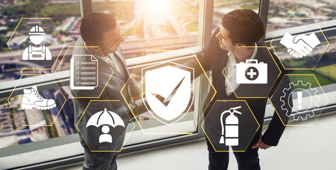 Business Partners Discuss Safety Protocols and Compliance Strategies in Modern Office Environment...