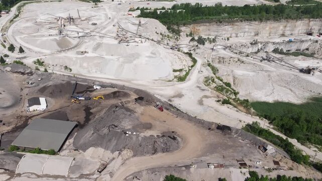 Drone Orbits Above an Aggregate Quarry and Processing Plant with Stockpiles and Crushing Equipment