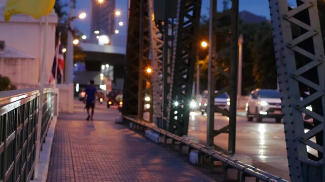 Memorial Bridge Bangkok at Dusk with Pedestrians and Traffic, Thai Flags Waving in Evening Light