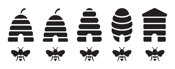 Naklejka premium Traditional beehive skep icons and flying bees silhouettes for organic honey farm labels and apiculture logos.