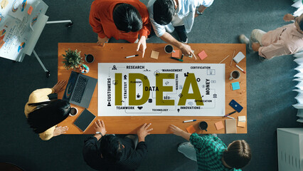 Diverse Team Collaborating on Business Strategy, Using Data and Research in a Creative Workspace Environment Haptic. © InfiniteFlow