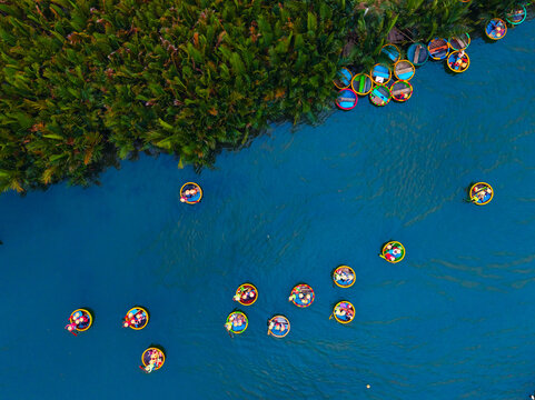 Colorful travel view basket boats on thu bon river, hoi an, vietnam, scenic tropical landscape
