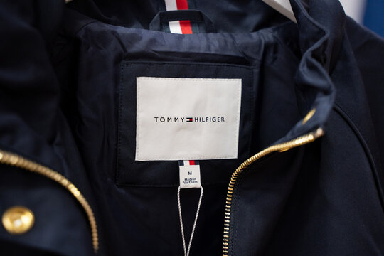 Close up of Tommy Hilfiger clothing label inside navy jacket. Toronto, Canada - July 30, 2026.