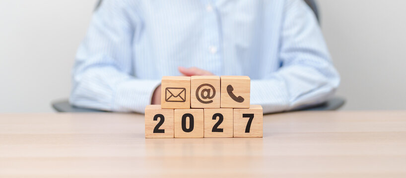 Happy New Year 2027 block for Contact Us concepts. Wood block of Email, call Phone and Website Address sign. For Customer support hotline, business Marketing, Corporate, communication and Advertising