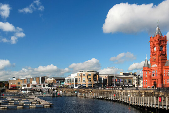 Waterfront promenade buildings and the landmark Pierhead building at Cardiff Bay Wales