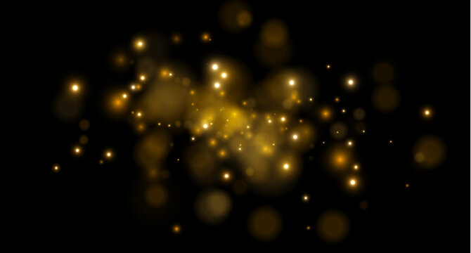 Golden light particles scattered against a dark background create a glowing bokeh effect. The luminous orbs vary in size and intensity with soft edges.