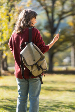Woman traveler with smartphone in her hands