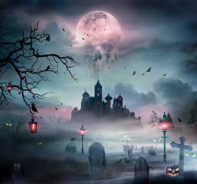 Halloween Landscape - Medieval Castle In Grave With Fog And Skull Moon - Jack O&rsquo; Lantern In Darkness At Moonlight