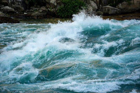 Close up of powerful whitewater river rapids.