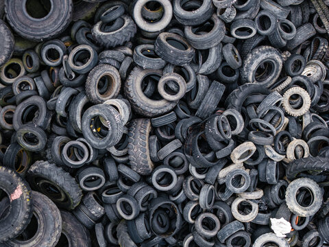 Aerial view of a large pile of discarded rubber tires stacked haphazardly in a recycling area in Laidzes pagasts, Talsu novads, Latvia.