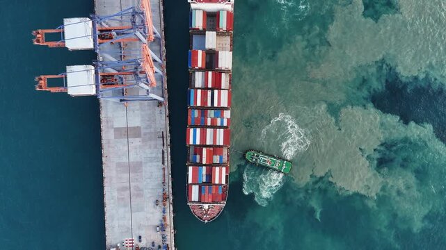 Container ship maneuvering at sea port terminal assisted by tugboats. Heavy cargo vessel docking for freight. Global maritime logistics, international shipping trade, and marine transport.