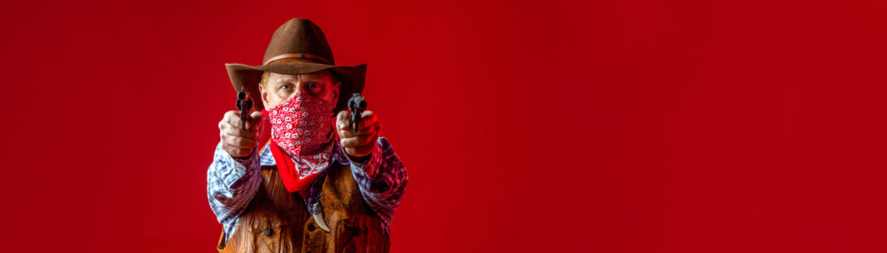 Cowboy with a pistol, guy in a cowboy hat with a gun. Western man with hat. American farmer. Man wearing cowboy hat, gun. West, guns. Portrait of a cowboy