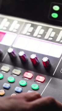 Sound engineer operator working on mixing console workplace during live event concert on stage show broadcast, light mixer controller panel, lighting technician workplace with professional equipment