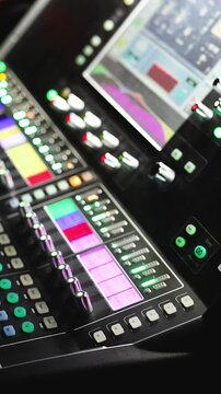 Sound engineer operator working on mixing console workplace during live event concert on stage show broadcast, light mixer controller panel, lighting technician workplace with professional equipment