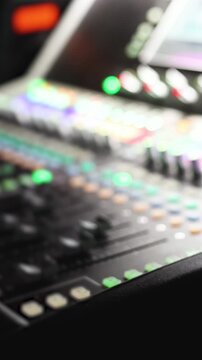 Sound engineer operator working on mixing console workplace during live event concert on stage show broadcast, light mixer controller panel, lighting technician workplace with professional equipment