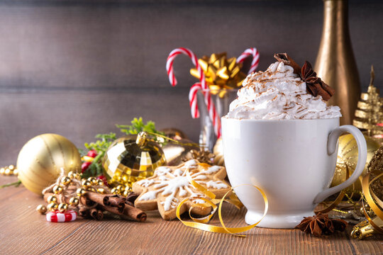 Hot chocolate, latte coffee or eggnog cocktail with whipped crea