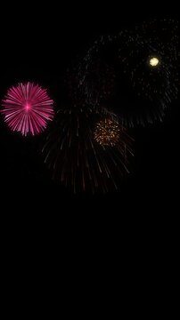 Multiple colorful fireworks bursting continuously on a vertical black overlay background