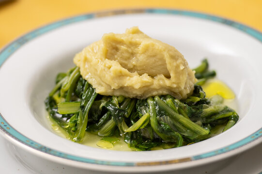 Fave bianche e cicorie (fava bean pur&eacute;e with chicory), a traditional, comforting rustic recipe from Puglia, region of southern Italy