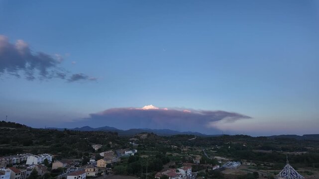 time lapse of a pyrocumulus formed by a large wildfire at sunset in a rural area in SE Spain. 4K shot.