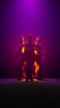 3D Render of Circle of Female Statues Illuminated by Purple Spotlight and Gold Glow